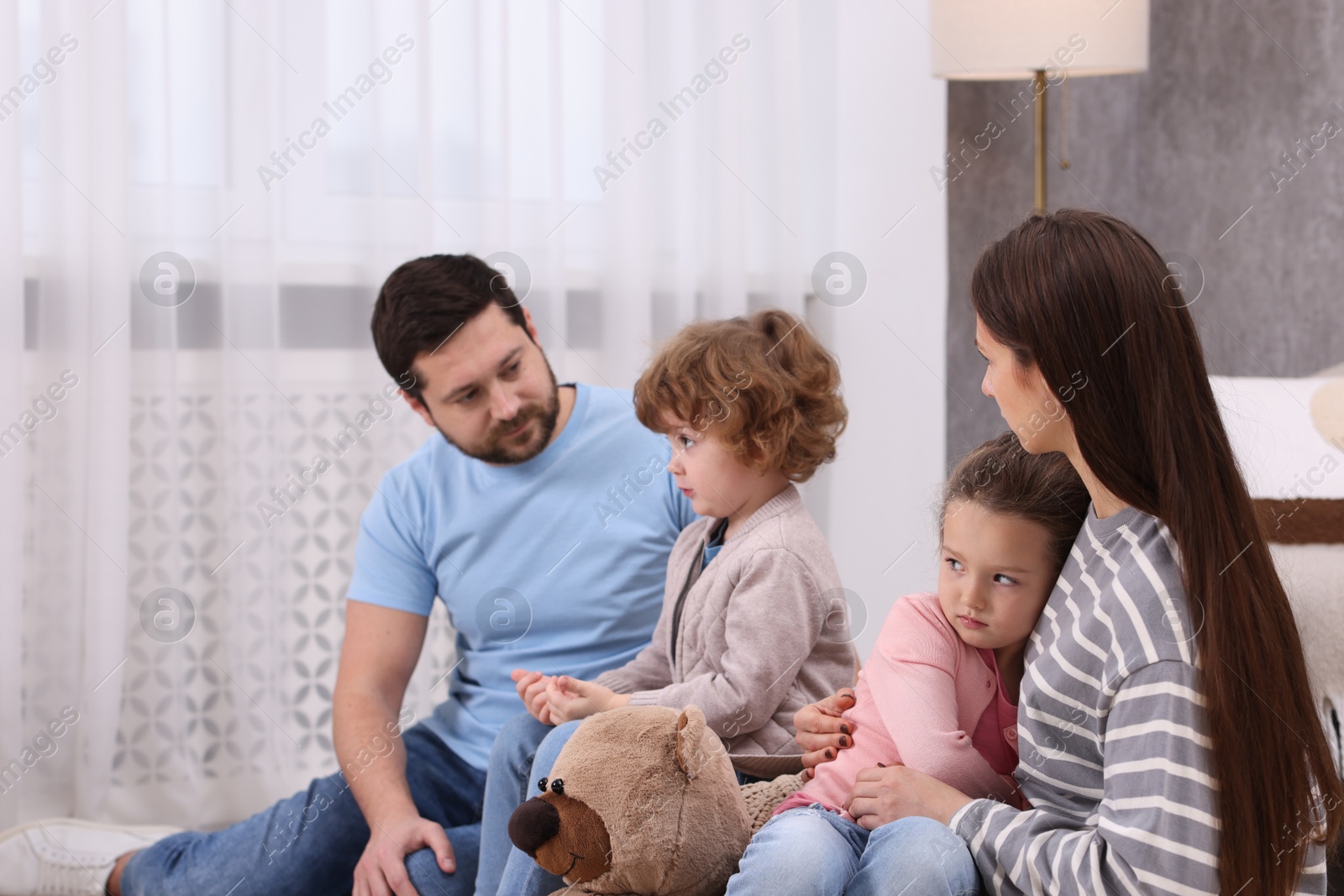 Photo of Resentful little kids and their parents arguing at home