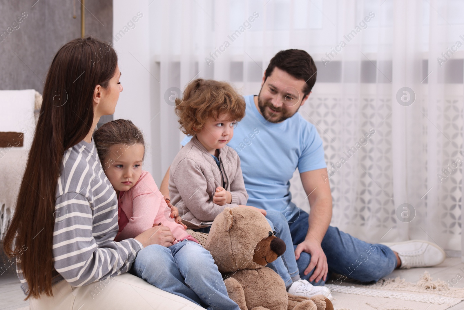 Photo of Resentful little kids and their parents arguing at home