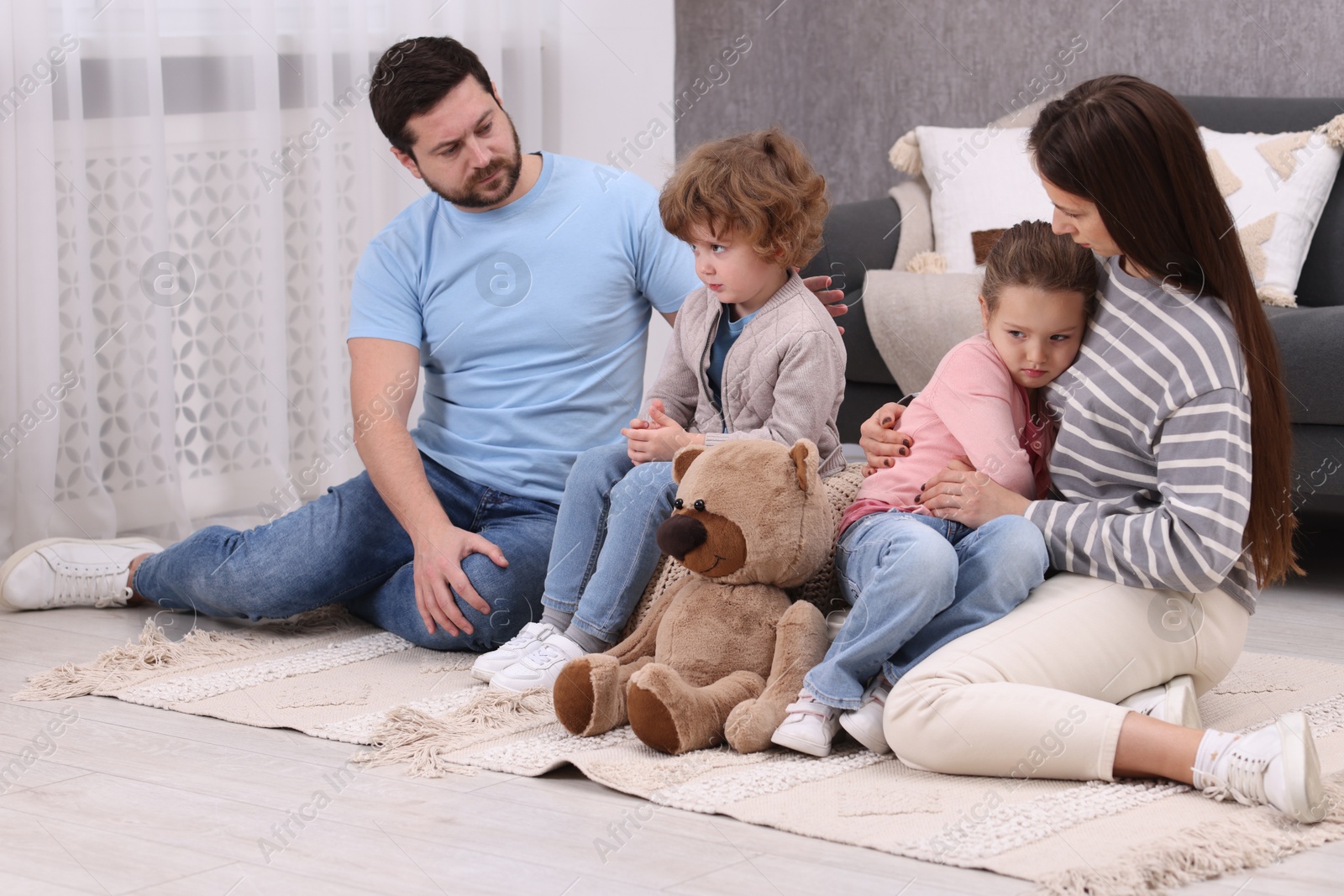 Photo of Resentful little kids and their parents arguing at home