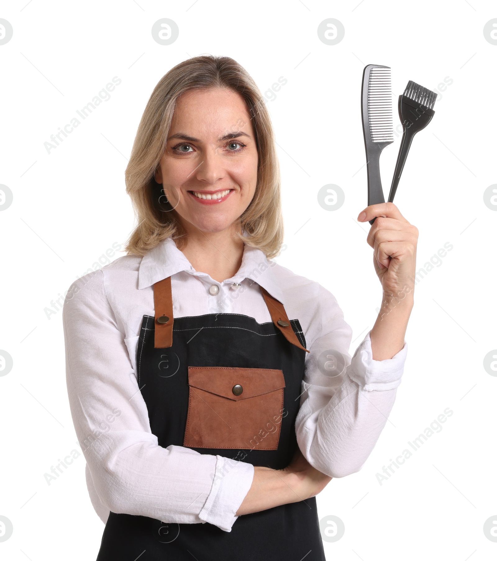 Photo of Smiling hairdresser with comb and hair dye brush on white background