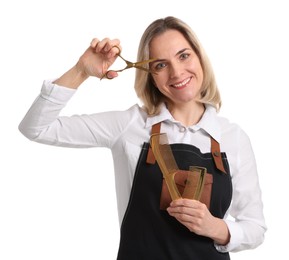 Photo of Smiling hairdresser with combs and scissors on white background