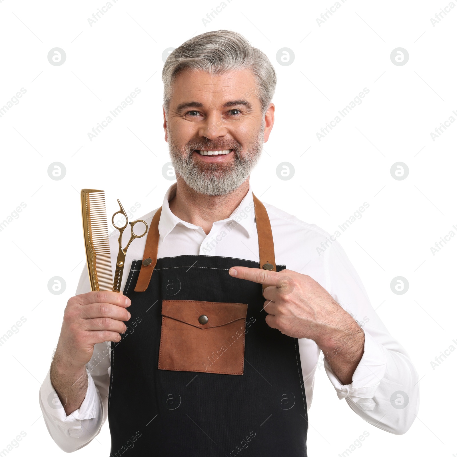 Photo of Smiling hairdresser with comb and scissors on white background