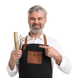 Photo of Smiling hairdresser with comb and scissors on white background