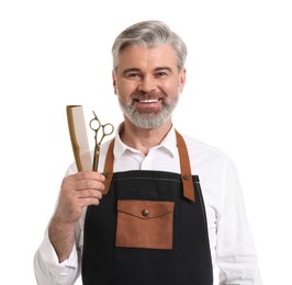 Photo of Smiling hairdresser with comb and scissors on white background