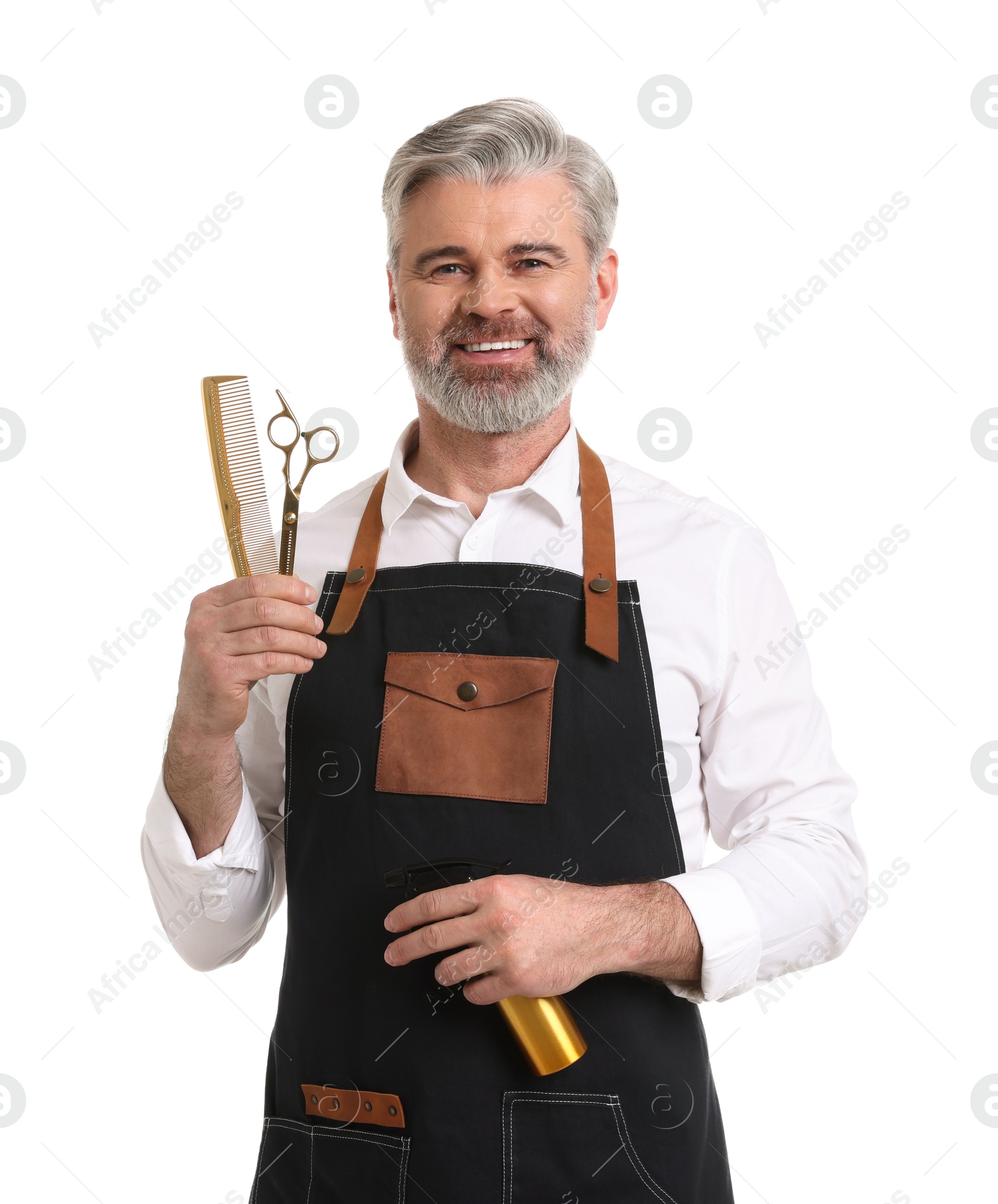 Photo of Smiling hairdresser with comb, scissors and spray bottle on white background