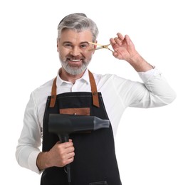 Photo of Smiling hairdresser with dryer and scissors on white background