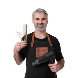 Photo of Smiling hairdresser with dryer, comb and scissors on white background