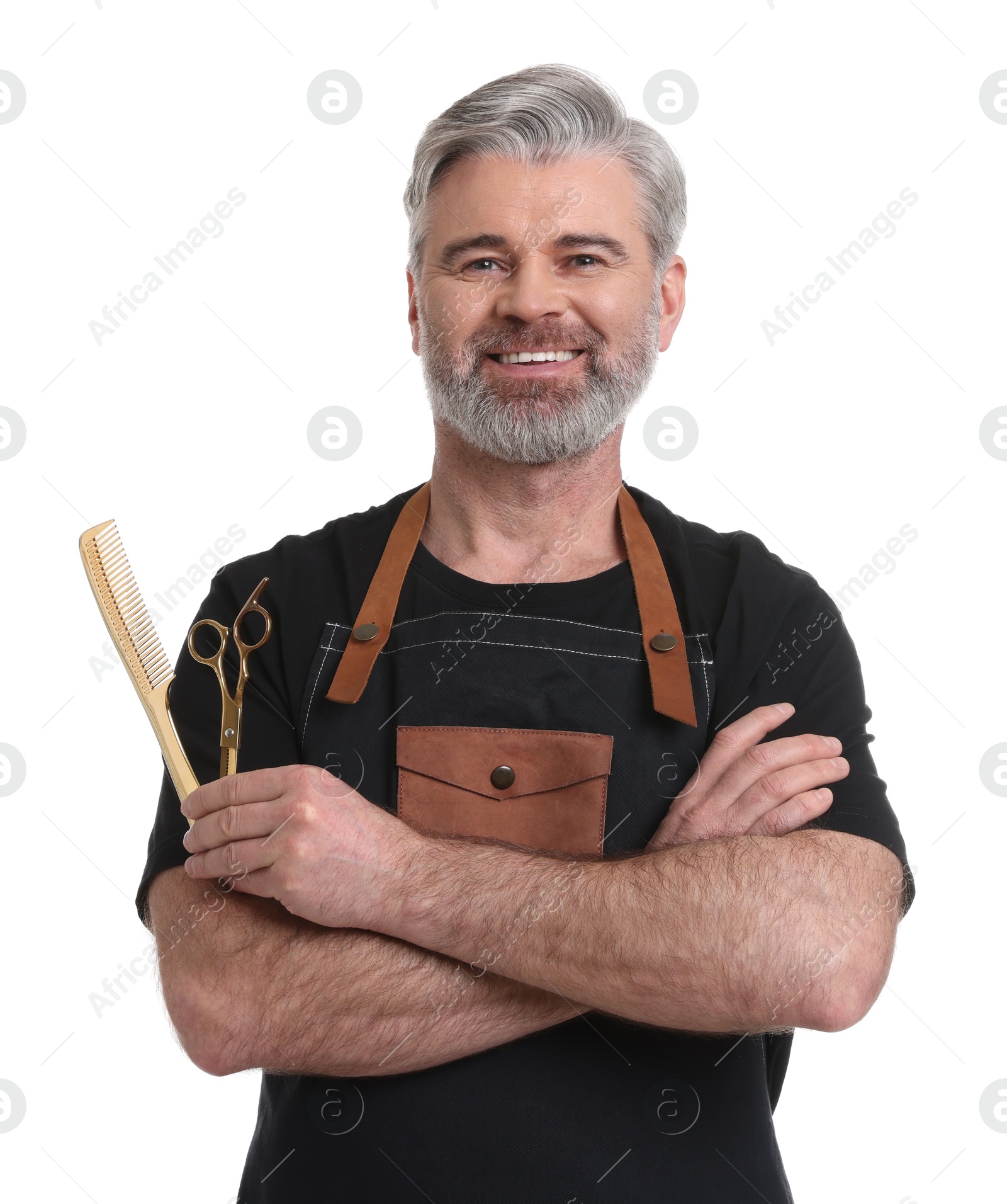 Photo of Smiling hairdresser with comb and scissors on white background