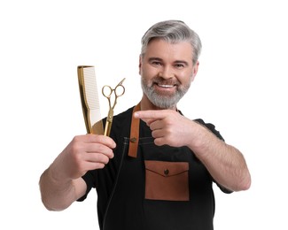 Photo of Smiling hairdresser with comb and scissors on white background