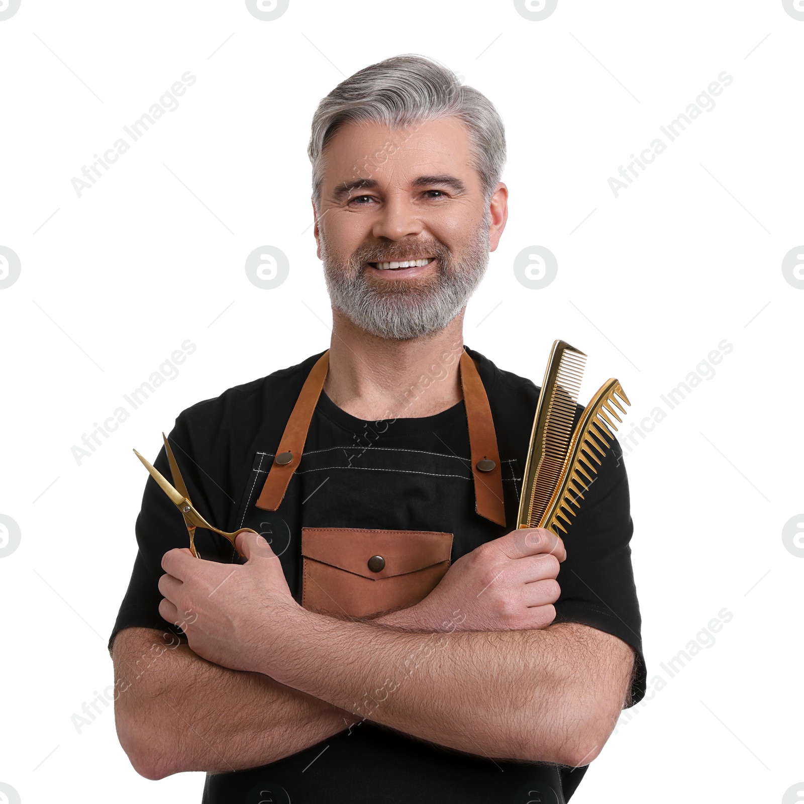 Photo of Smiling hairdresser with combs and scissors on white background