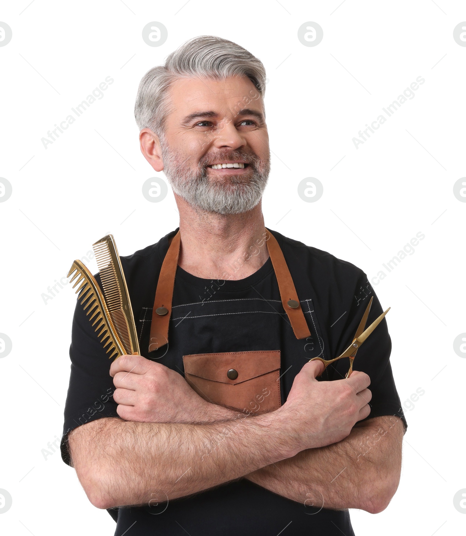 Photo of Smiling hairdresser with combs and scissors on white background