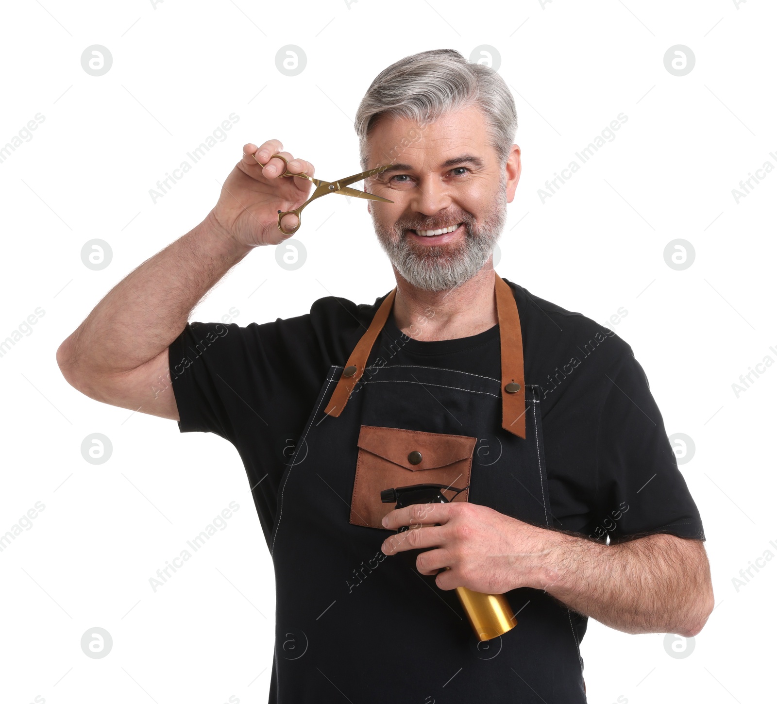 Photo of Smiling hairdresser with scissors and spray bottle on white background