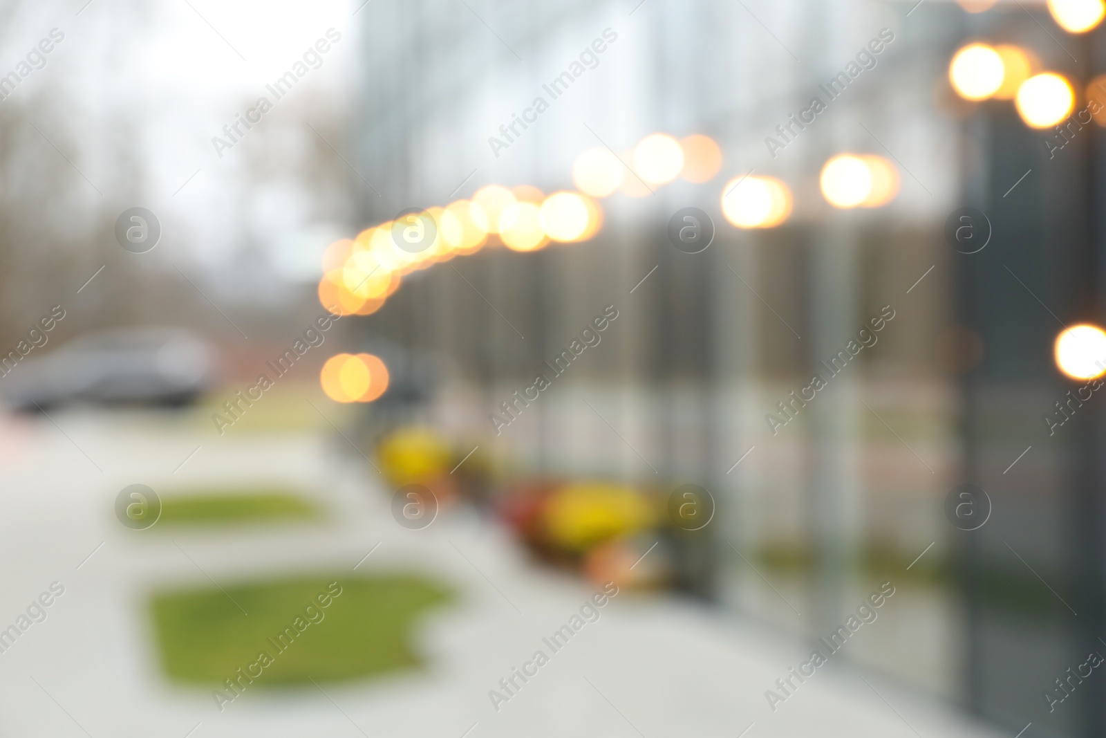 Photo of Blurred view of modern building with many windows outdoors