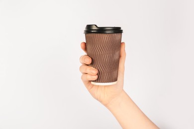 Photo of Woman holding paper cup on white background, closeup. Mockup for design