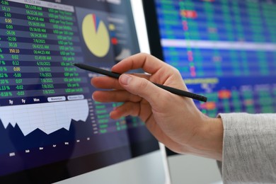 Photo of Financial trading specialist working with data in office, closeup