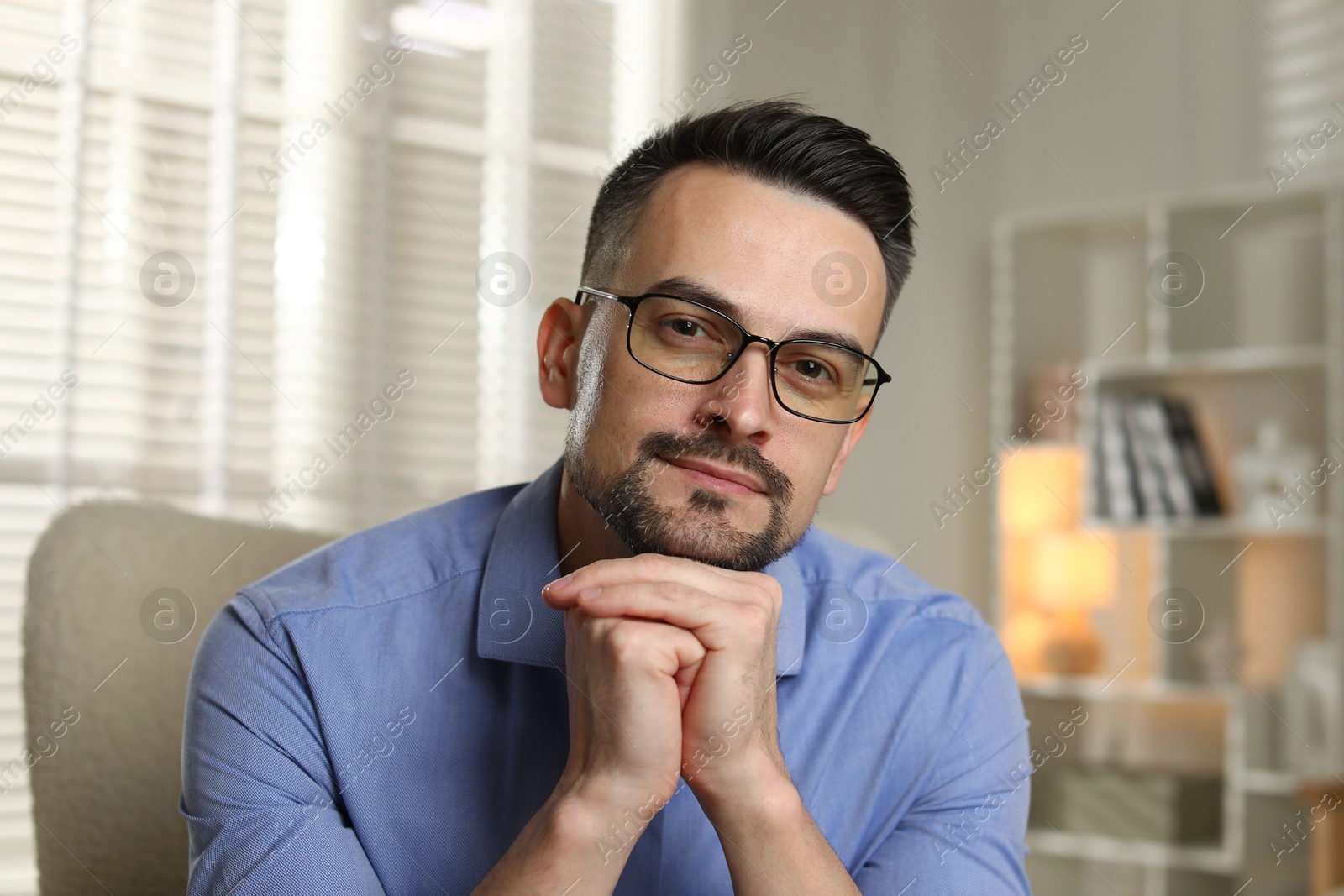 Photo of Portrait of handsome middle aged man indoors