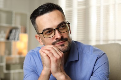 Photo of Portrait of handsome middle aged man indoors