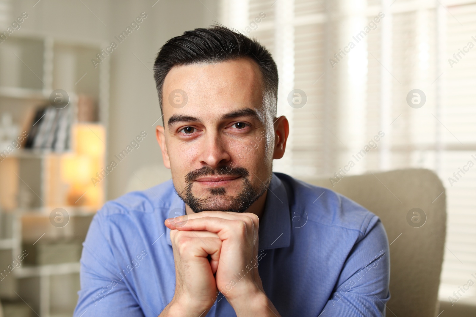 Photo of Portrait of handsome middle aged man indoors