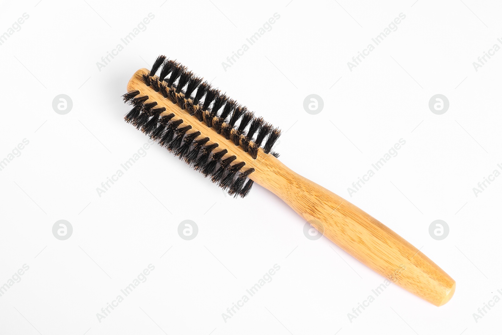 Photo of Hairdresser tool. Round wooden brush on white background, top view