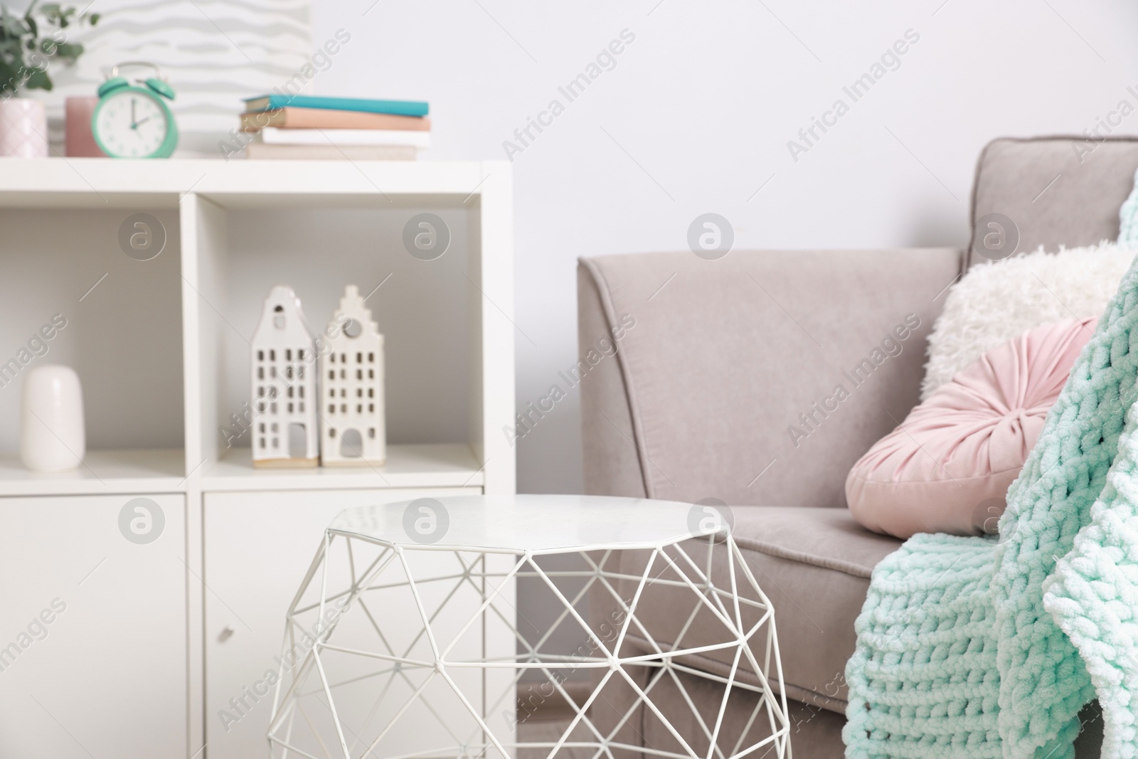 Photo of Stylish coffee table near sofa at home