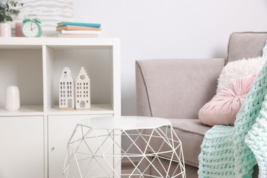 Photo of Stylish coffee table near sofa at home