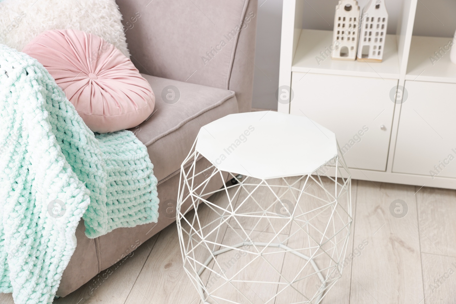 Photo of Stylish coffee table near sofa at home