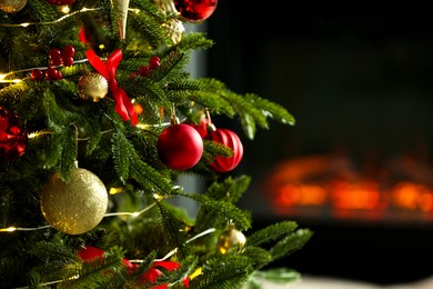 Photo of Beautiful decorated Christmas tree indoors, closeup. Space for text