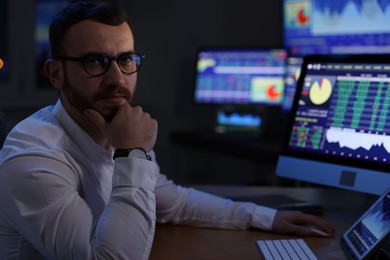 Photo of Portrait of financial trading specialist in office at night