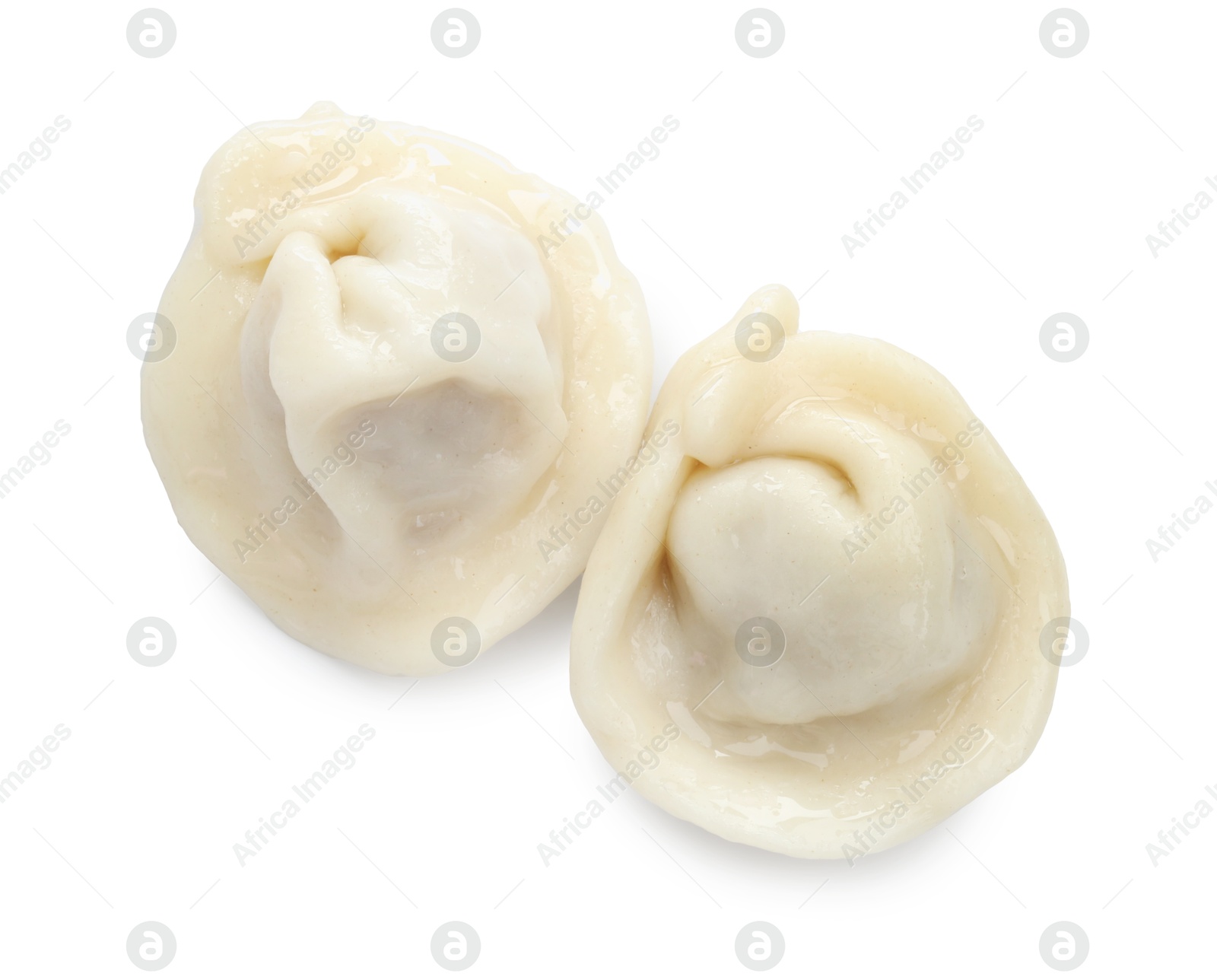 Photo of Delicious boiled dumplings (pelmeni) isolated on white, top view