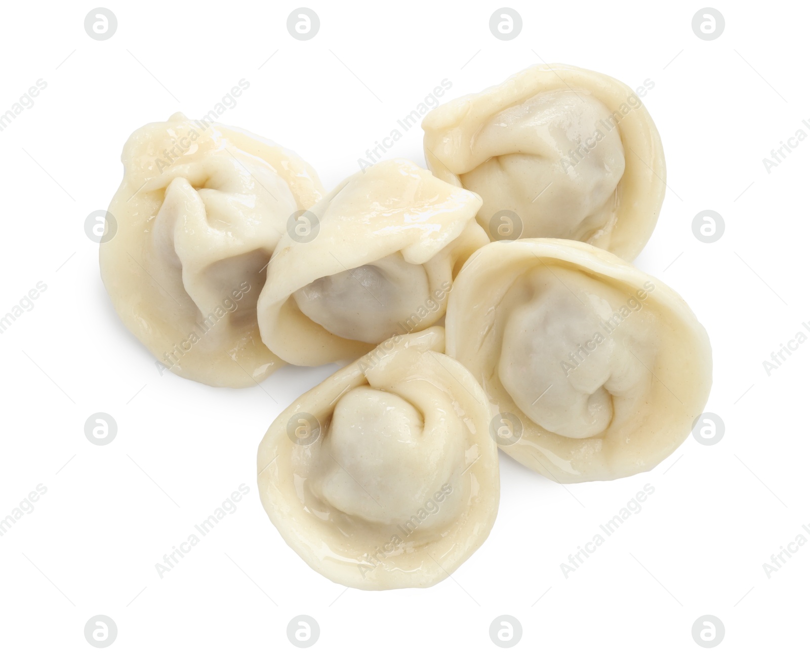 Photo of Delicious boiled dumplings (pelmeni) isolated on white, top view