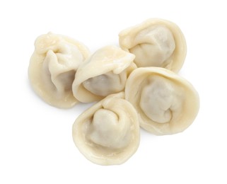 Photo of Delicious boiled dumplings (pelmeni) isolated on white, top view