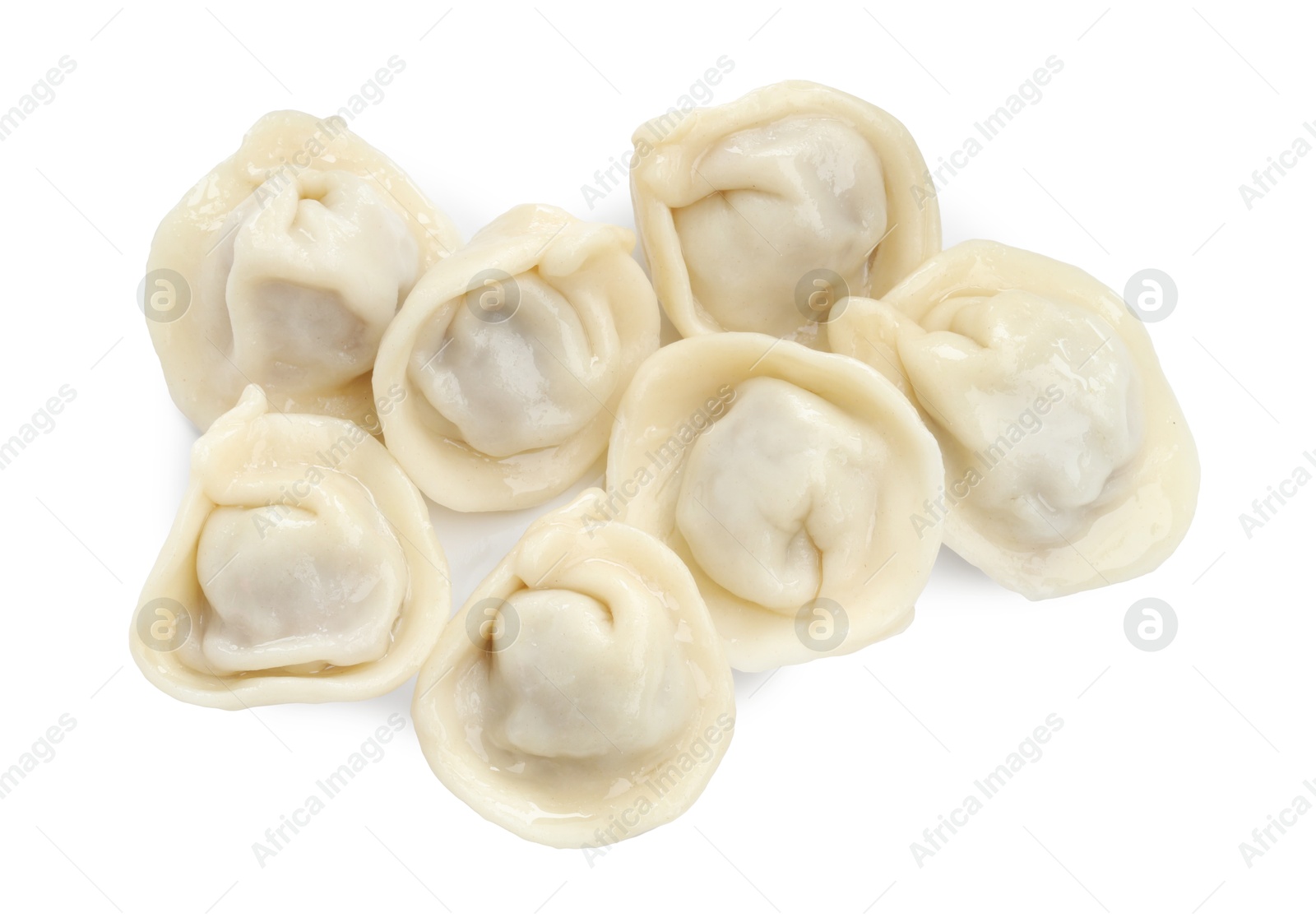 Photo of Delicious boiled dumplings (pelmeni) isolated on white, top view