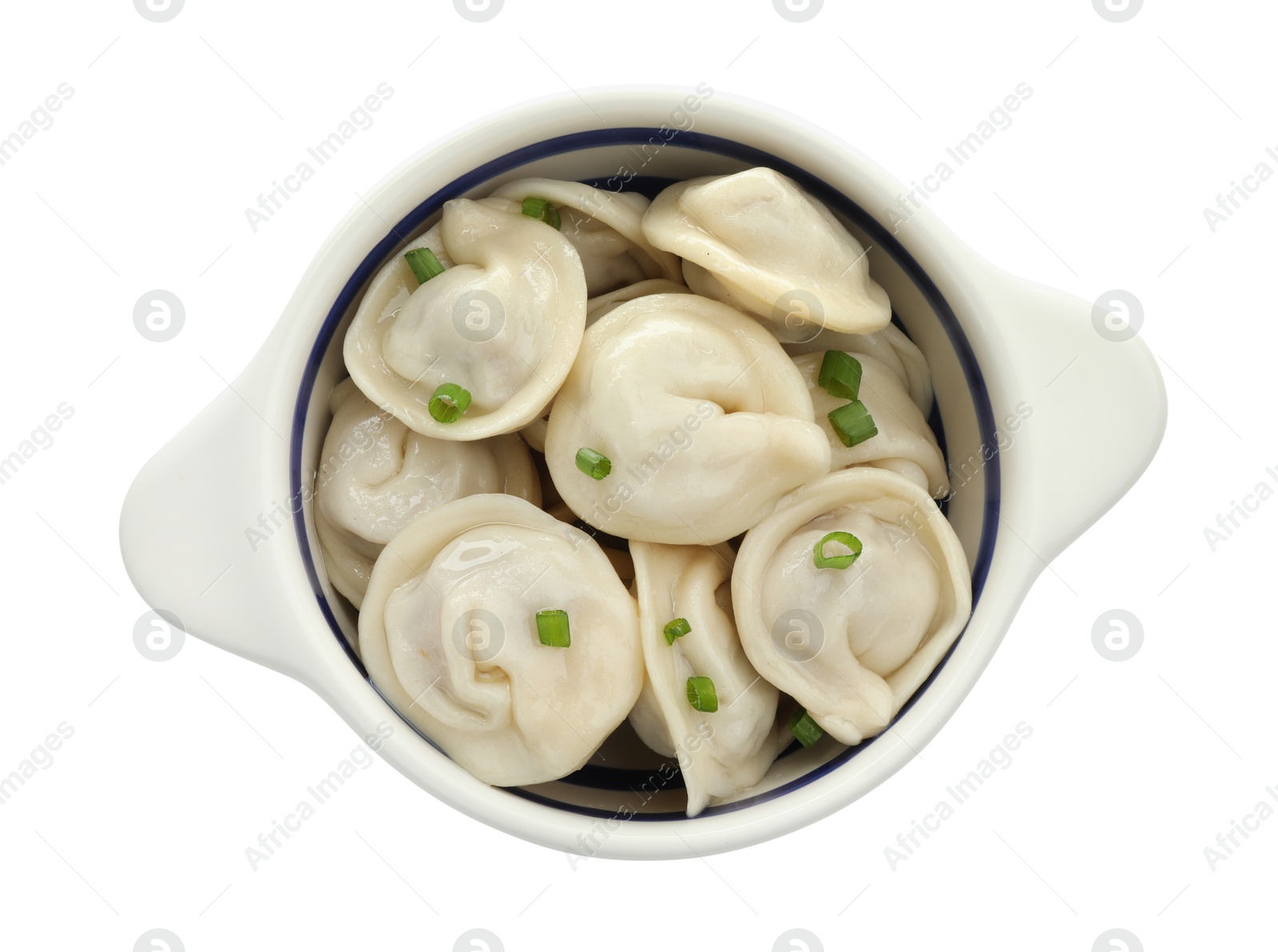 Photo of Delicious dumplings (pelmeni) with green onion in bowl isolated on white, top view