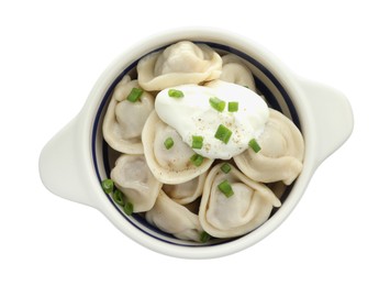 Photo of Delicious dumplings (pelmeni) with green onion and sour cream in bowl isolated on white, top view