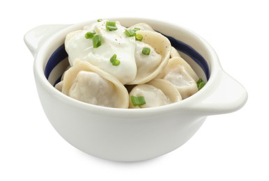 Photo of Delicious dumplings (pelmeni) with green onion and sour cream in bowl isolated on white