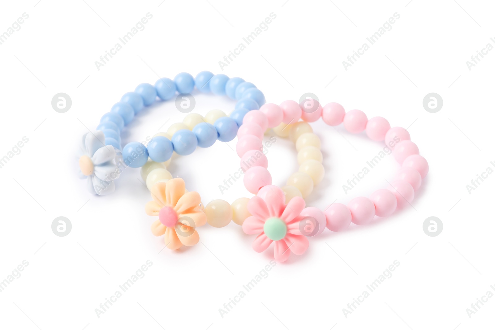 Photo of Colorful hair ties with flowers isolated on white