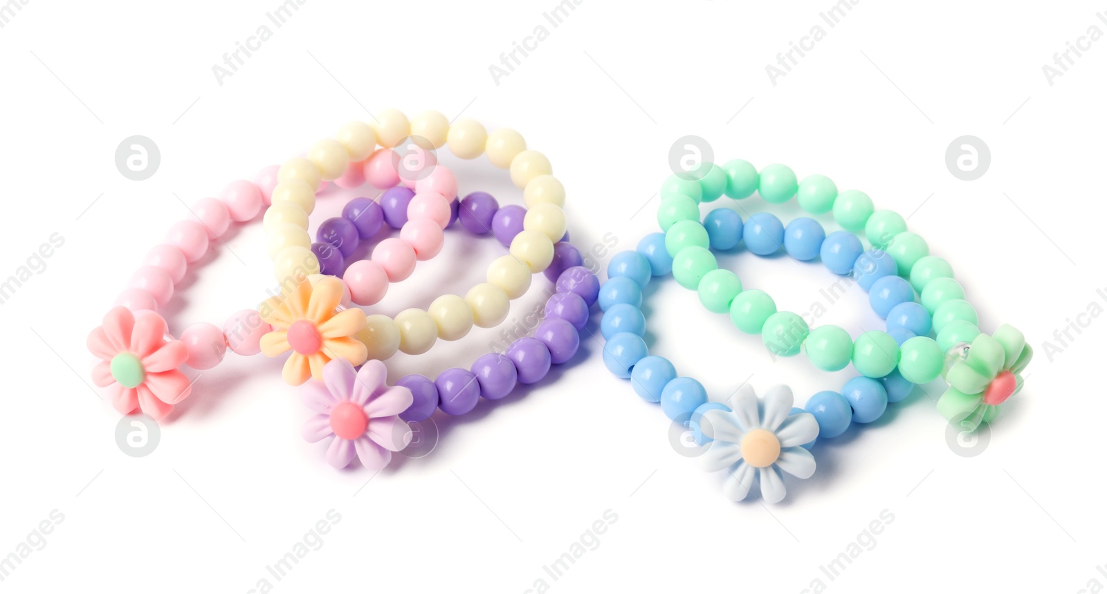 Photo of Colorful hair ties with flowers isolated on white