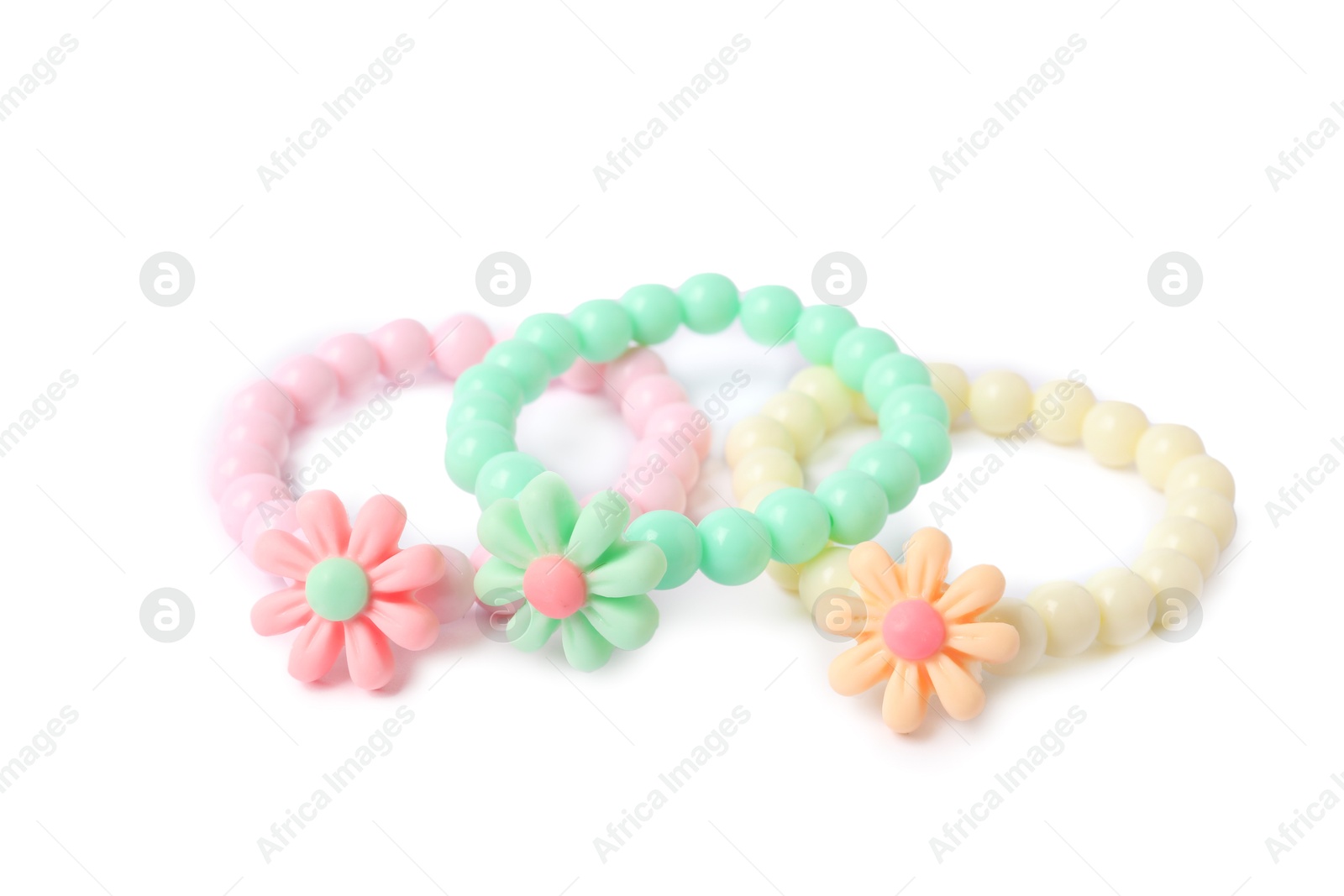 Photo of Colorful hair ties with flowers isolated on white