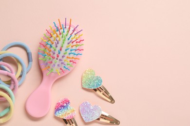 Photo of Colorful hair accessories on pink background, flat lay. Space for text