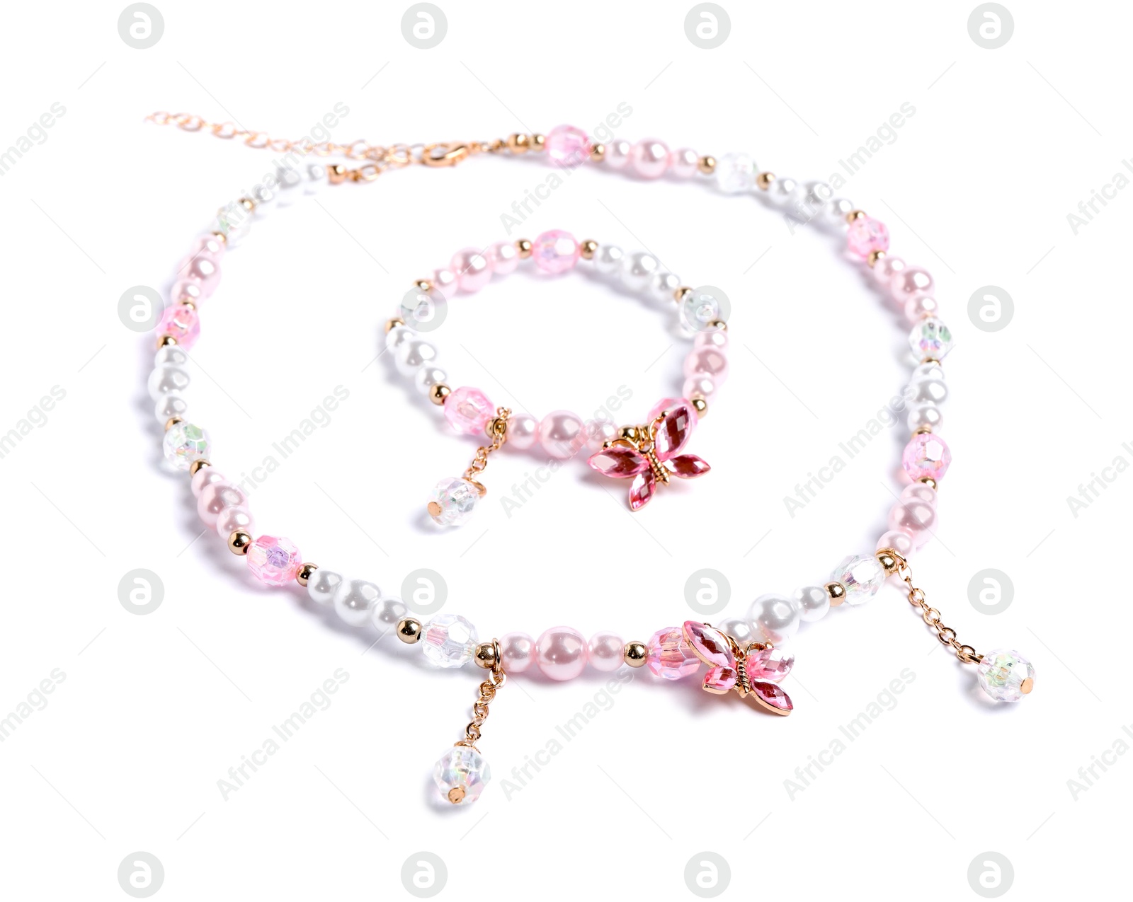 Photo of Cute necklace and bracelet isolated on white. Child's accessories