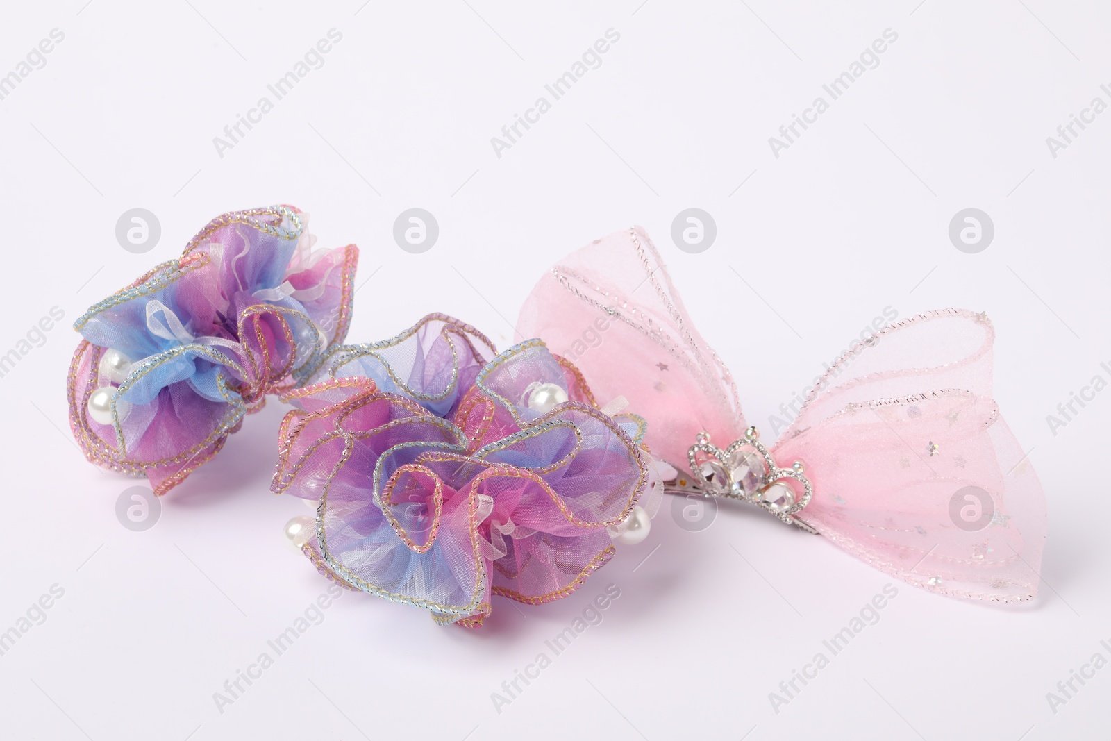 Photo of Cute colorful hair accessories on white background