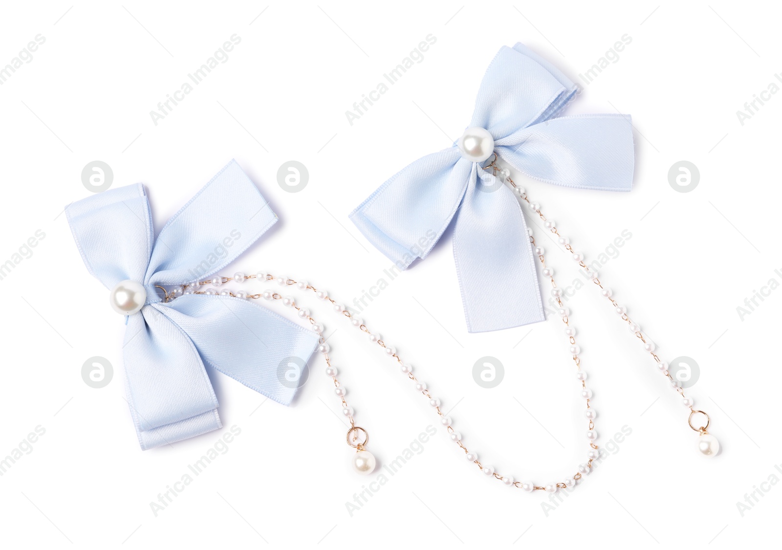 Photo of Beautiful hair bows with beads isolated on white, top view