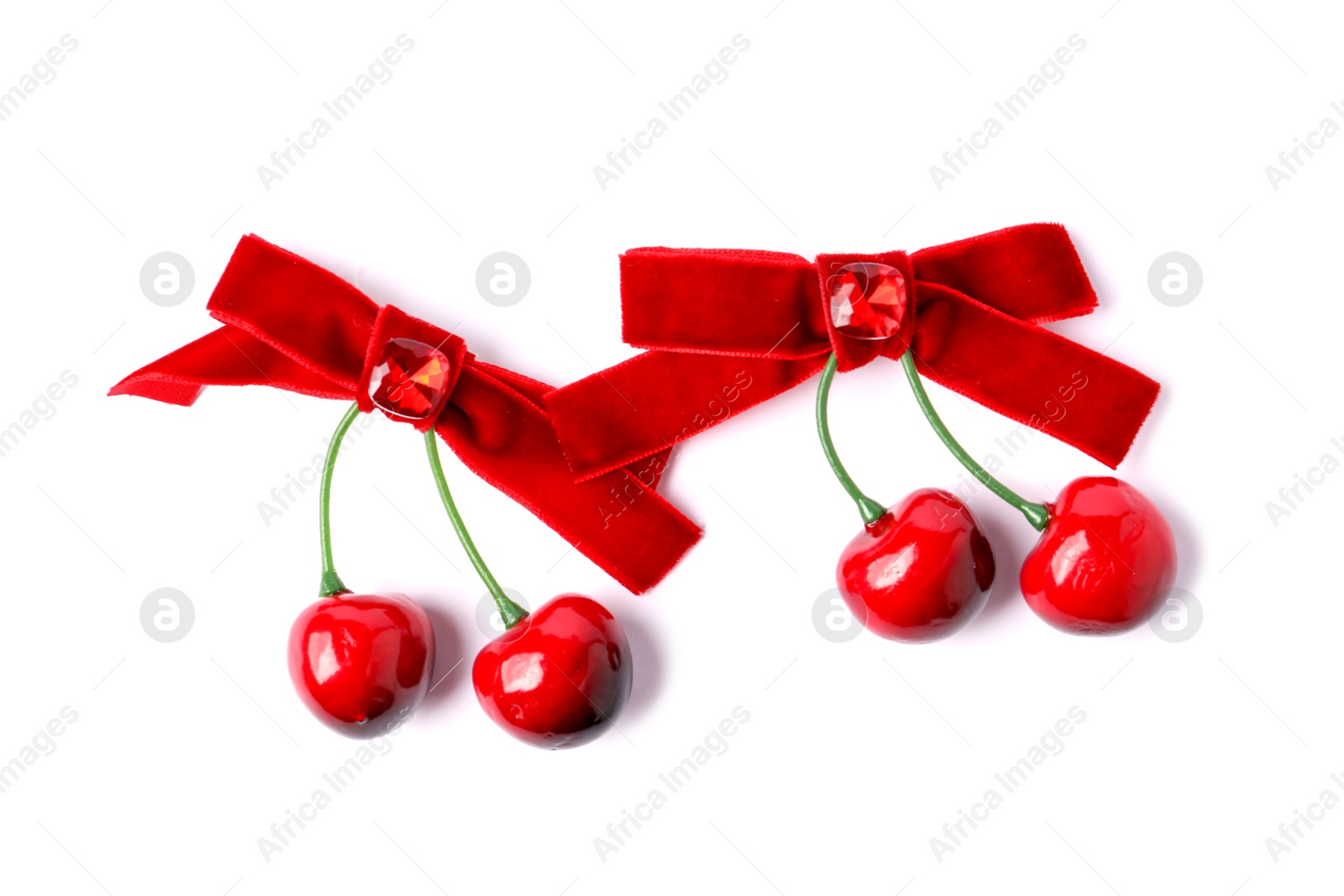 Photo of Beautiful hair bows with cherries isolated on white, top view