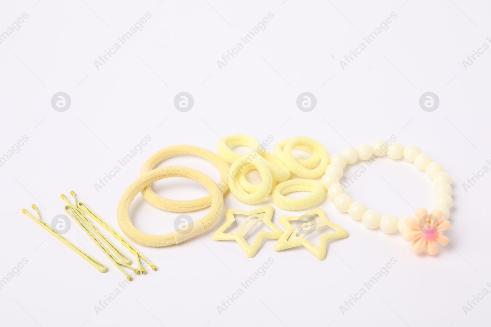 Photo of Yellow cute hair accessories on white background