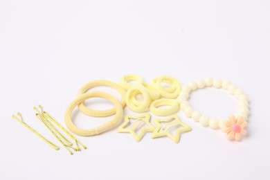 Photo of Yellow cute hair accessories on white background