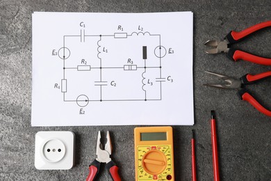 Photo of Different electrical tools and circuit diagram on grey table, flat lay