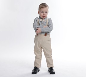 Photo of Full length portrait of cute little boy on white background