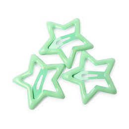 Photo of Many green star shaped hair clips isolated on white, top view