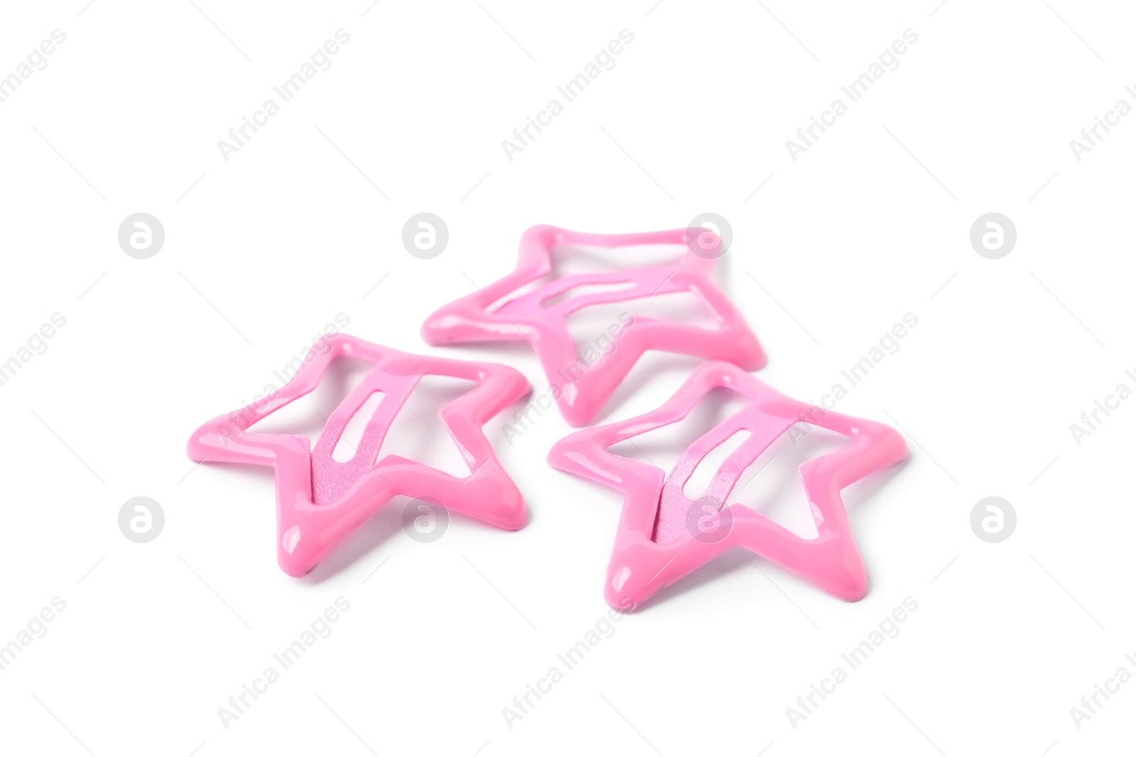 Photo of Many pink star shaped hair clips isolated on white