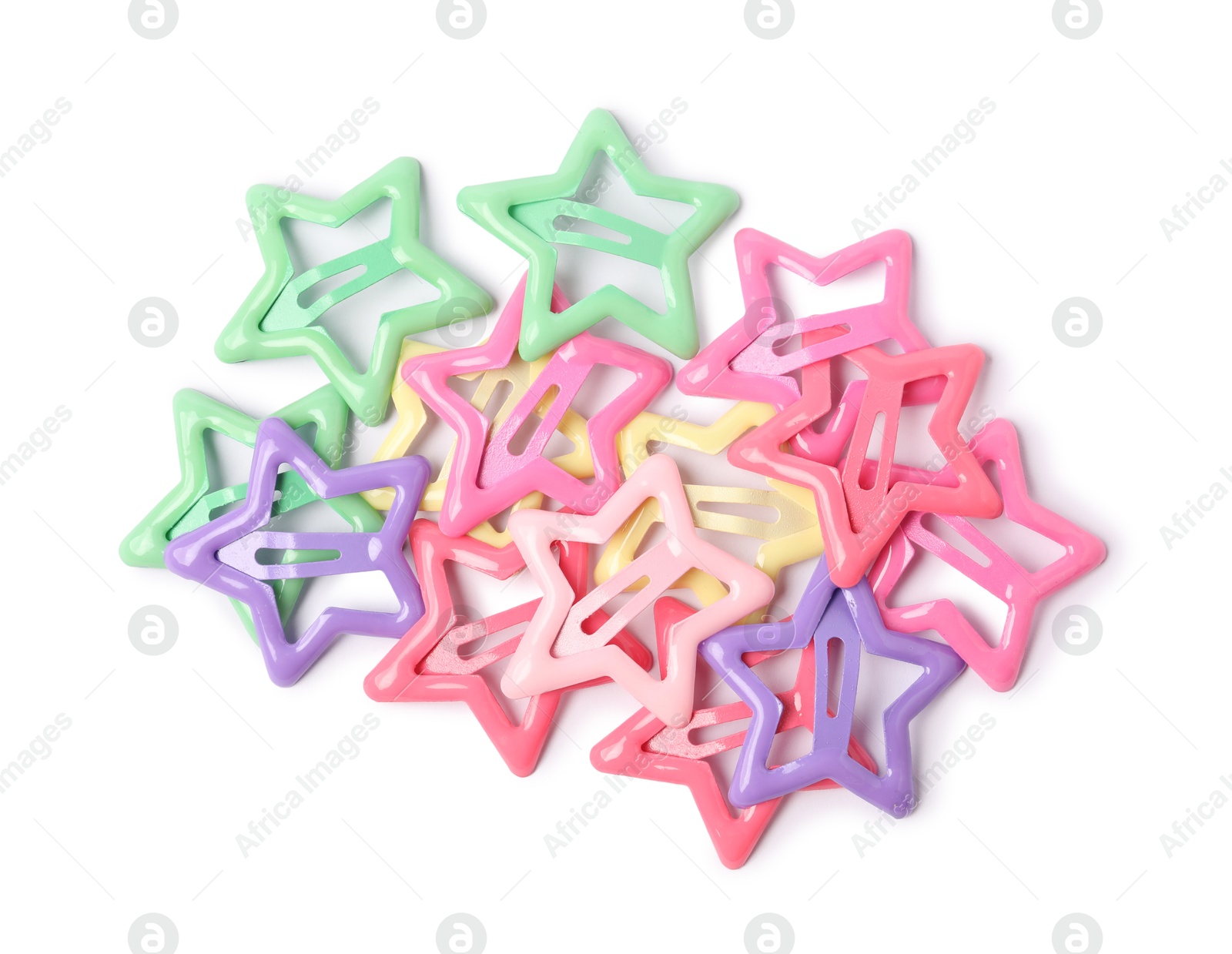 Photo of Many colorful star shaped hair clips isolated on white, top view